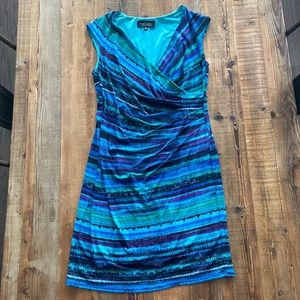 Body hugging dress with ruching to hide the midsection.